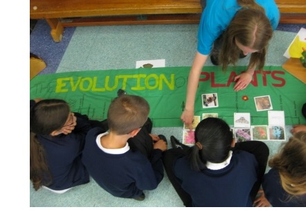 A student volunteer running a demonstration at a Cambridge Hands-On Science (CHaOS) Roadshow event.