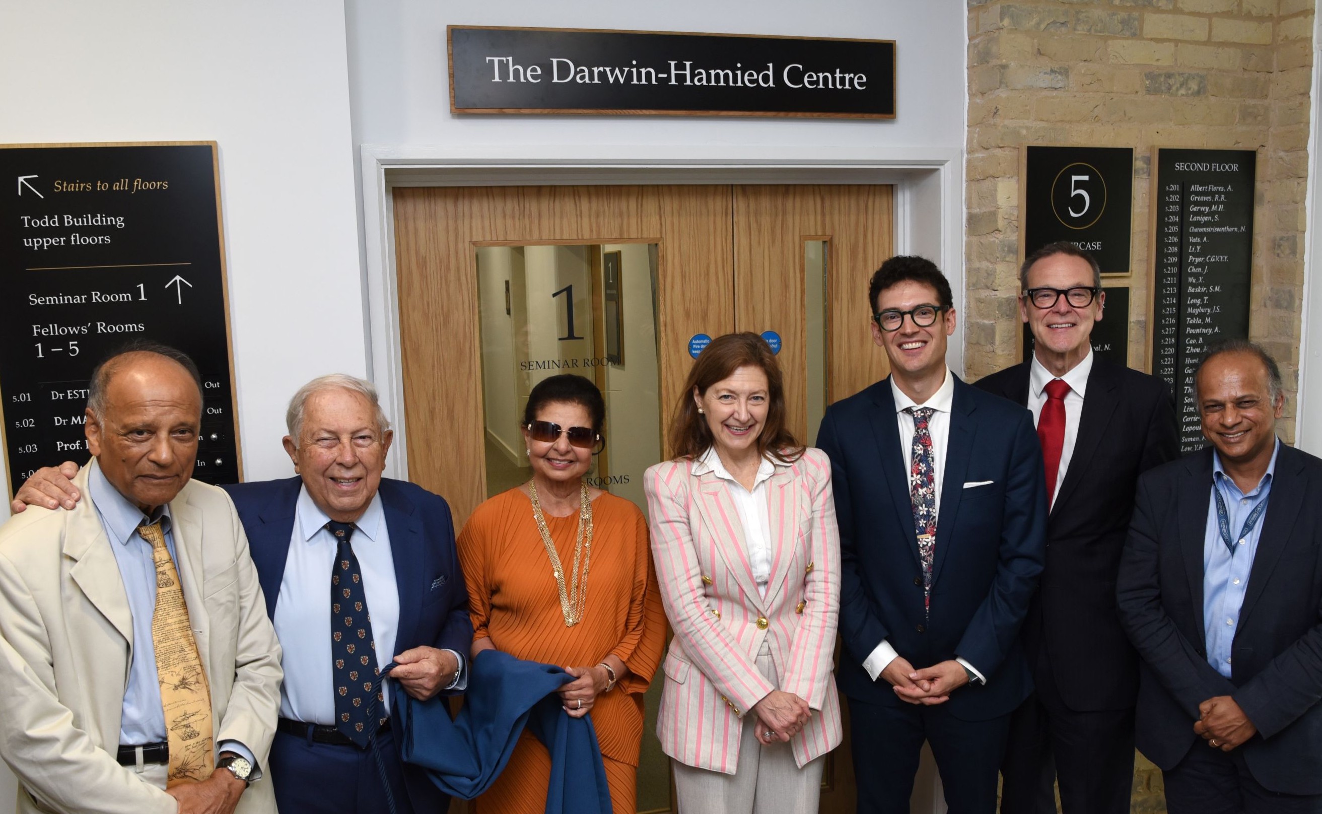 A group of people in front of the Darwin-Hamied Centre