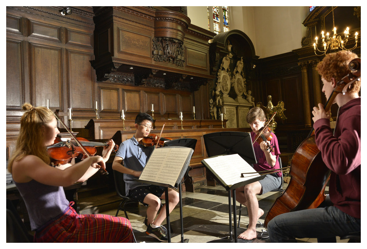 Students playing instruments in the Chapel