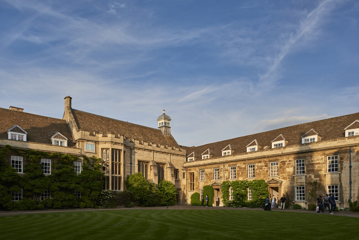 Hall and buildings seen from other side of circular lawn