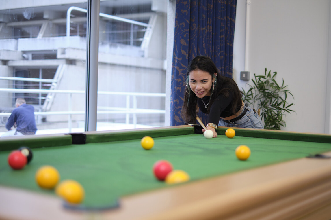 Female playing pool