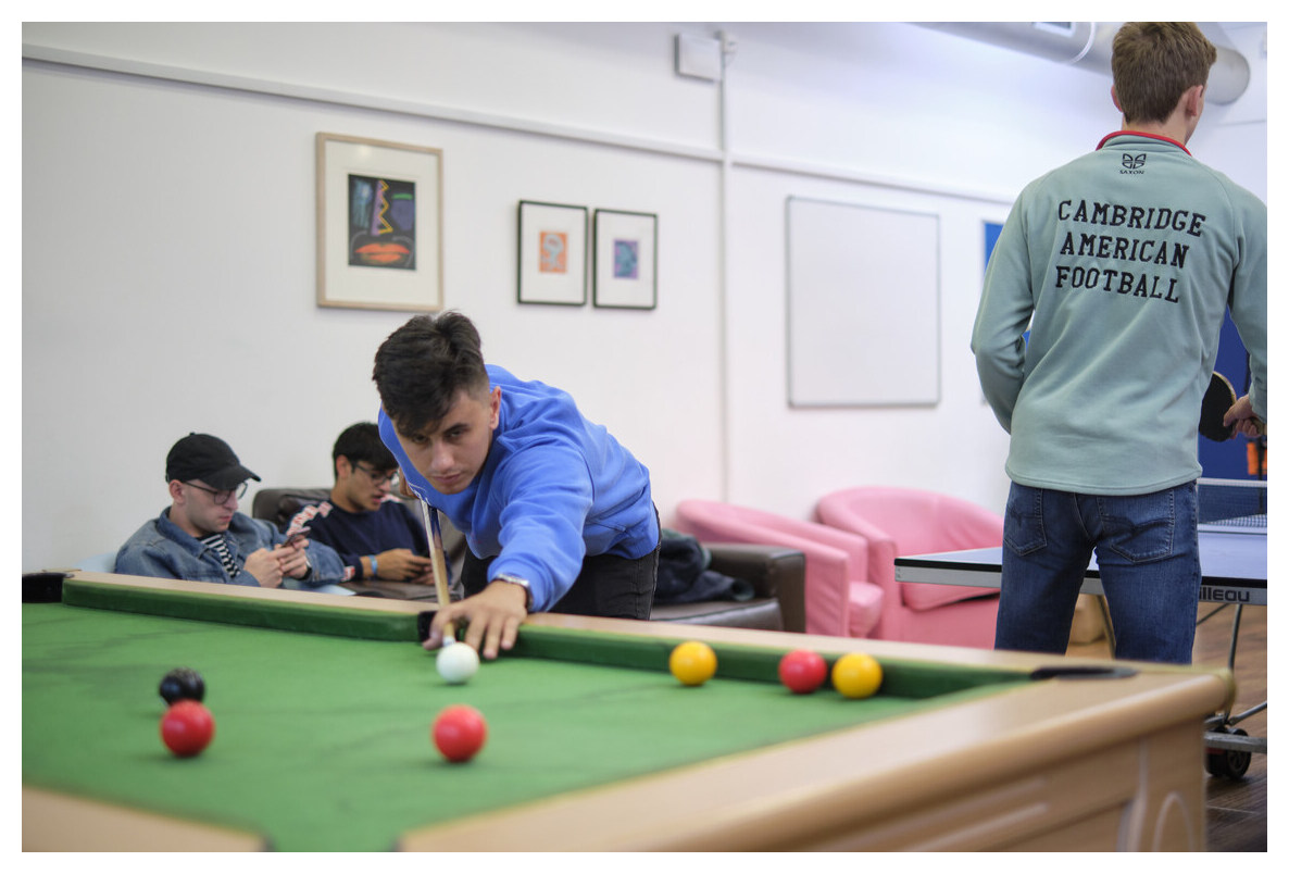 Student playing pool in the JCR Common Room