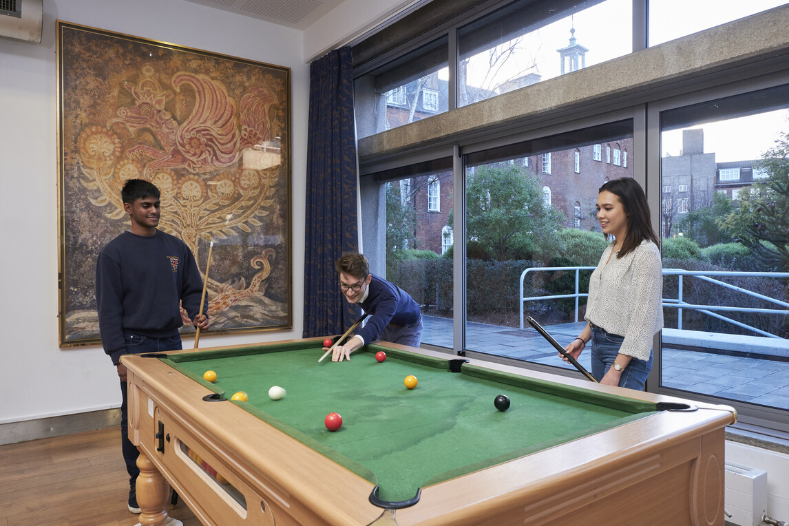 Three students at pool table