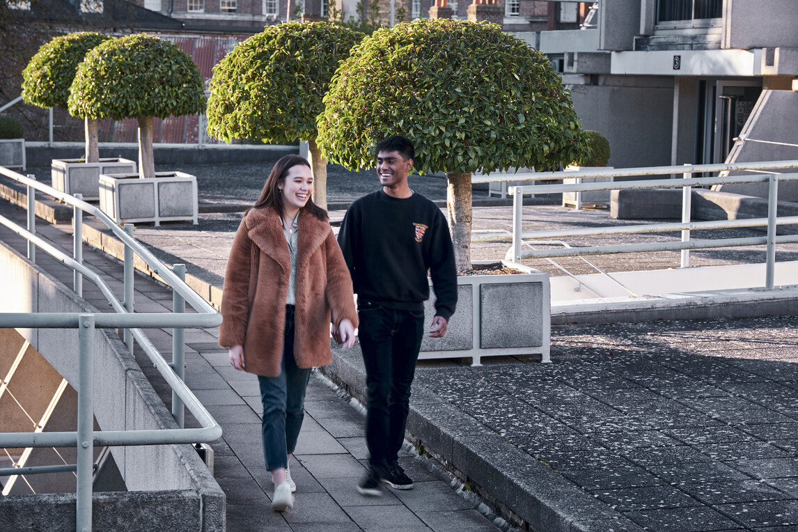 Two students walking on upper level