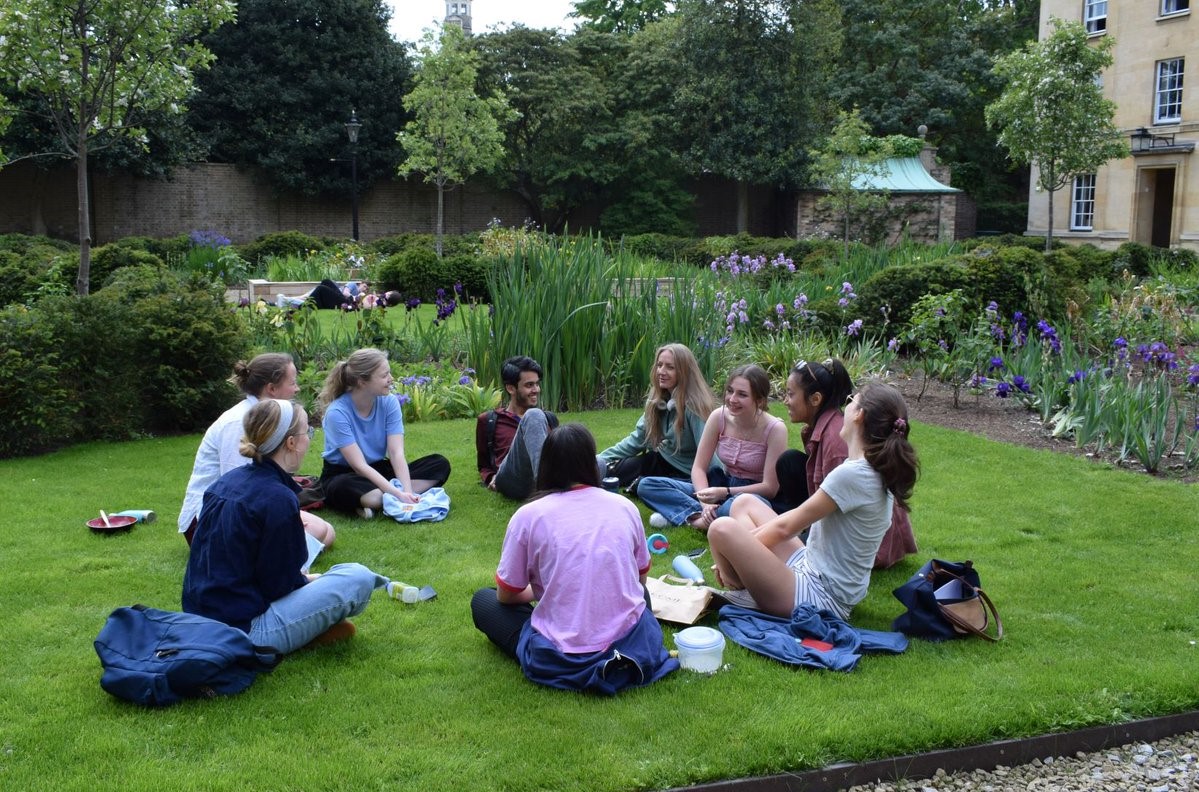 Students sat on the grass