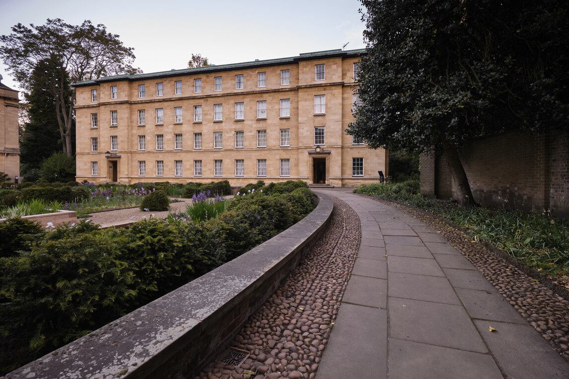 Path, low wall, flowerbed and Blyth Building