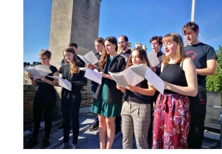The Choir of Christ's College, Cambridge, singing on top of the Great Gate in First Court to mark Ascension Day.