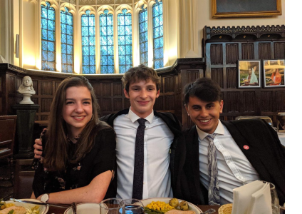 Diana and two friends attending a formal dinner at Christ's College, Cambridge.