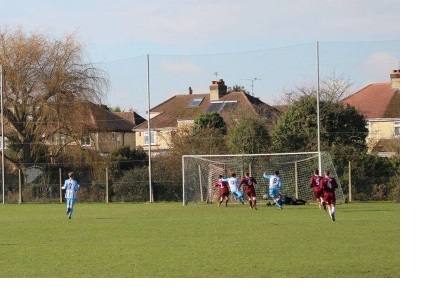 Players in the middle of a football match in the intercollegiate league of the University of Cambridge.