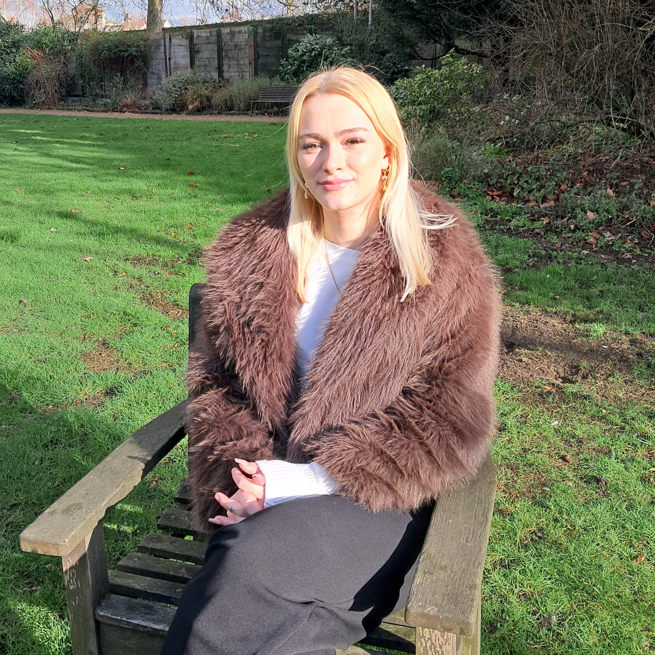 Isabel sitting in the Fellows' Garden