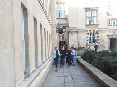 A student helper giving prospective students a tour of Christ's College, Cambridge.