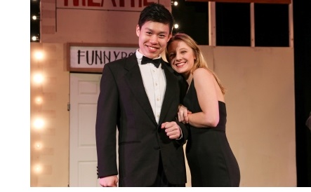 A couple in black tie, onstage during a performance of "The Producers", the Lent Term musical at the ADC Theatre in Cambridge.