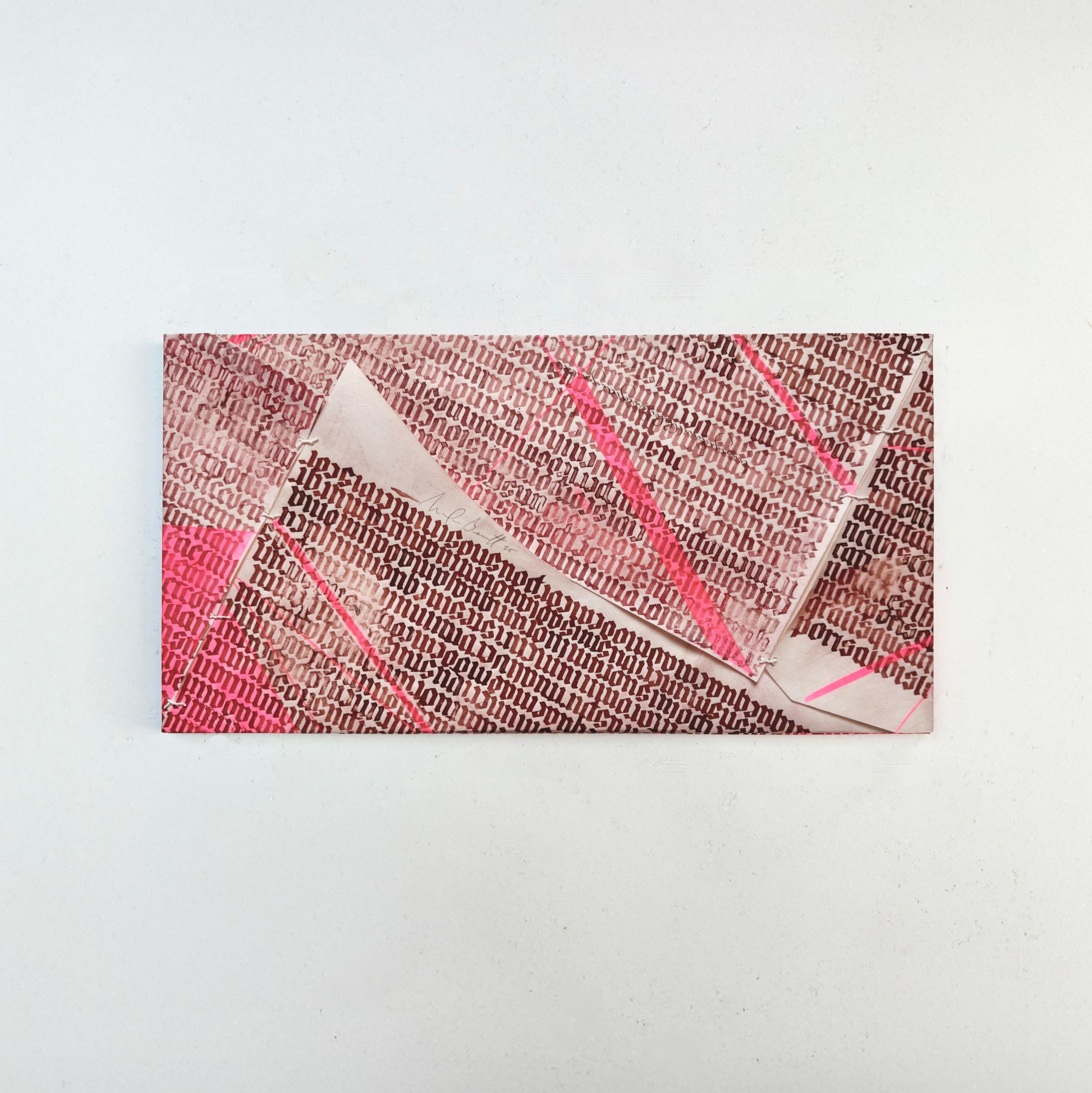 The back of Madison's artwork which The piece is folded around a wooden board and secured with parchment tackets, which allow the material to freely react to humidity without losing form