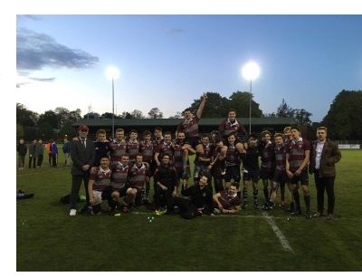 The men's rugby team at Christ's College, Cambridge, posing for a photo after victory in a Cuppers (intercollegiate) match.