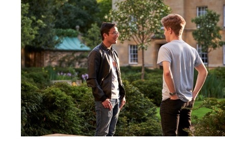 Two male students chatting in the centre of Third Court at Christ's College, Cambridge.