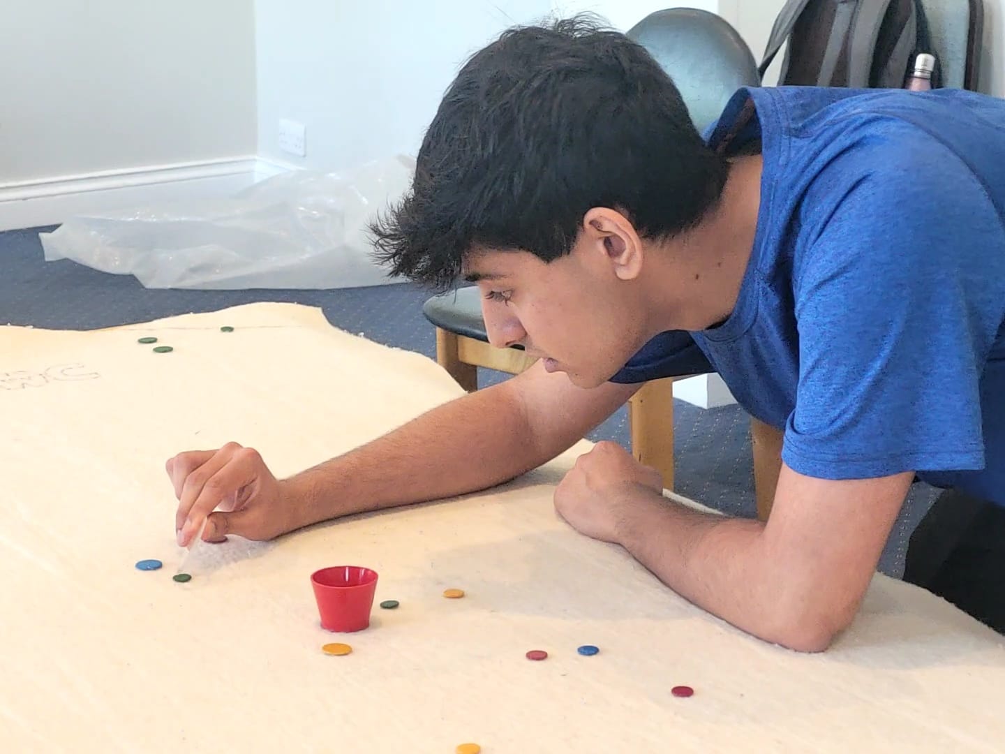 Adam playing tiddlywinks
