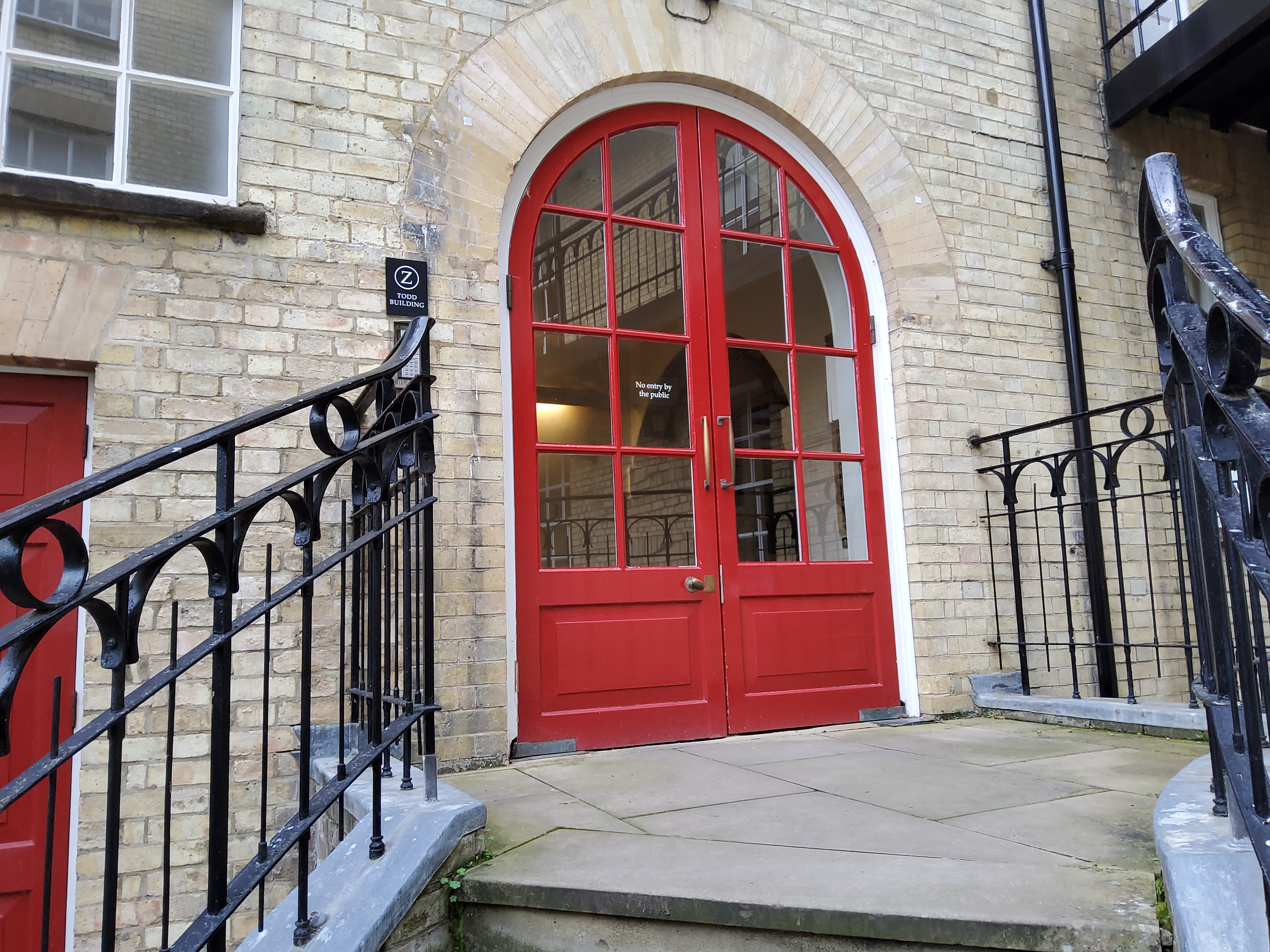 Steps up to red door