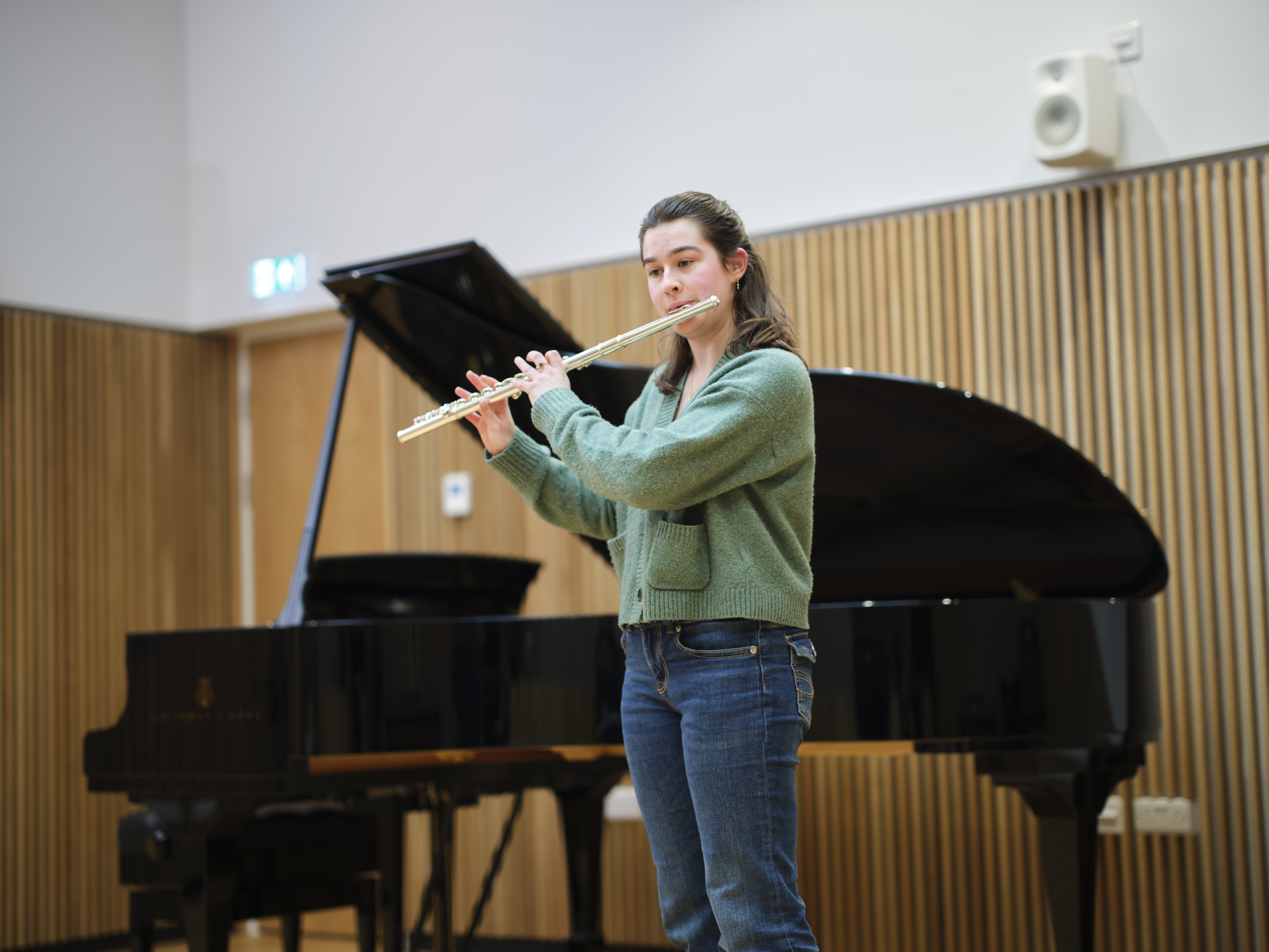 Female student playing the flute