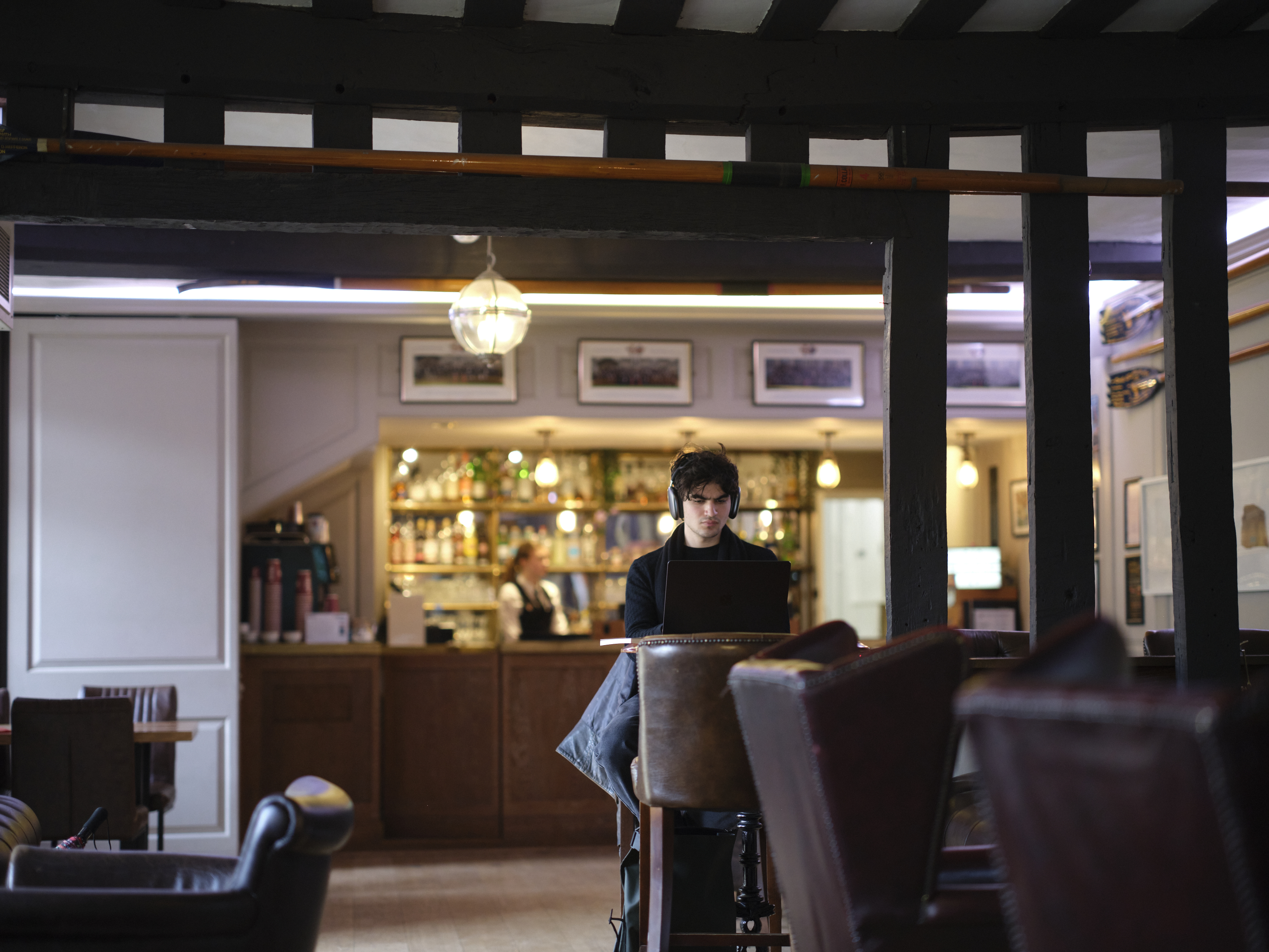 Student working in the bar