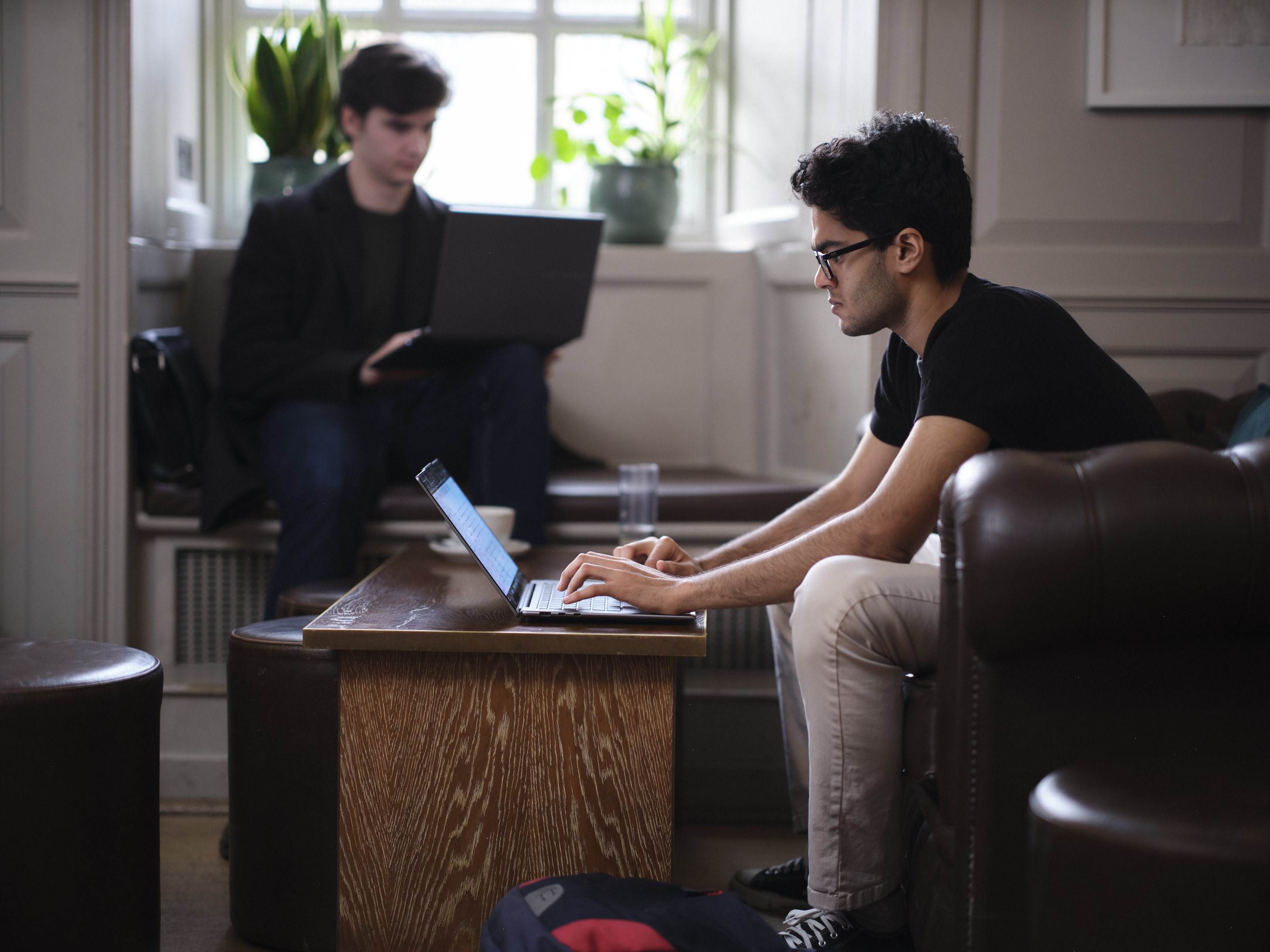Students on laptops in the Buttery