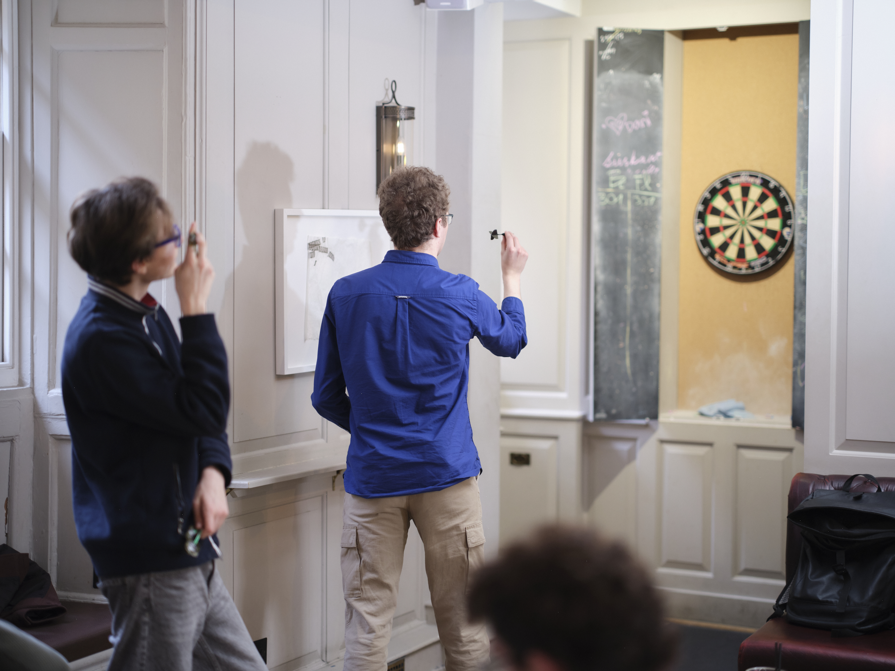Student playing darts
