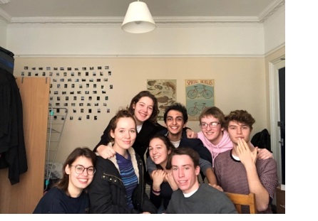 A group of students posing for a photo in a student room at Christ's College, Cambridge.