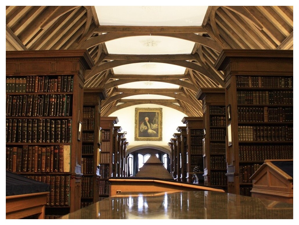 Passage through Old Library with bookshelves on either side