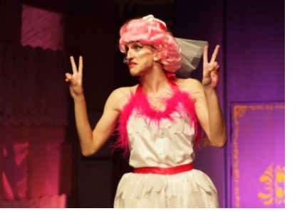 An actor in drag performing in the Cambridge Footlights Pantomime