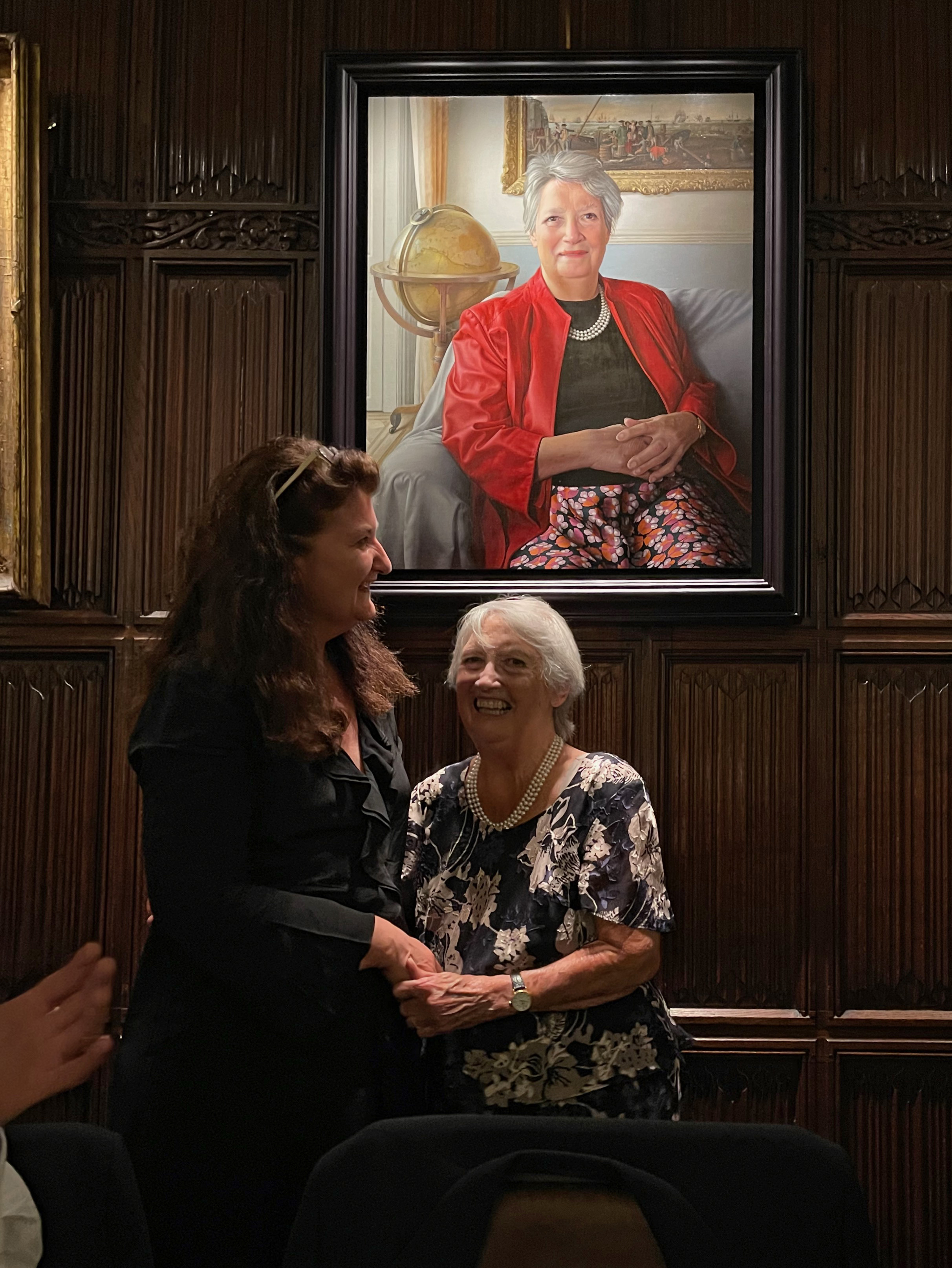 The artist and sitter in front of the portrait