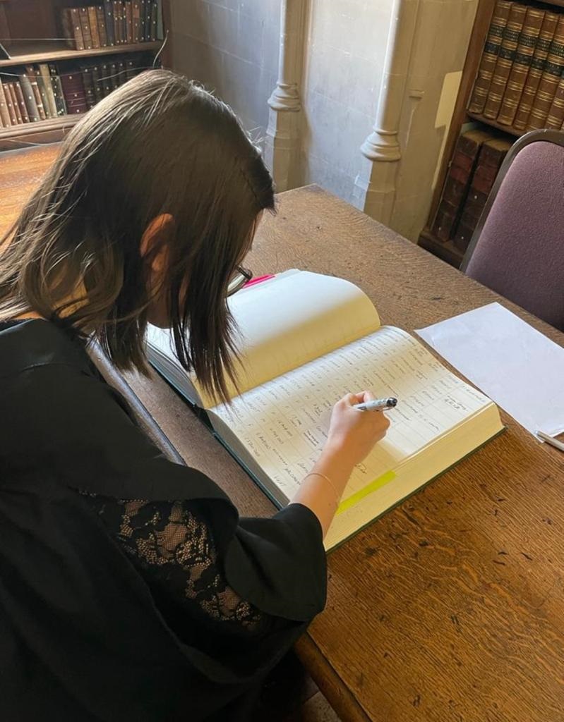 Student signing the Matriculation Register