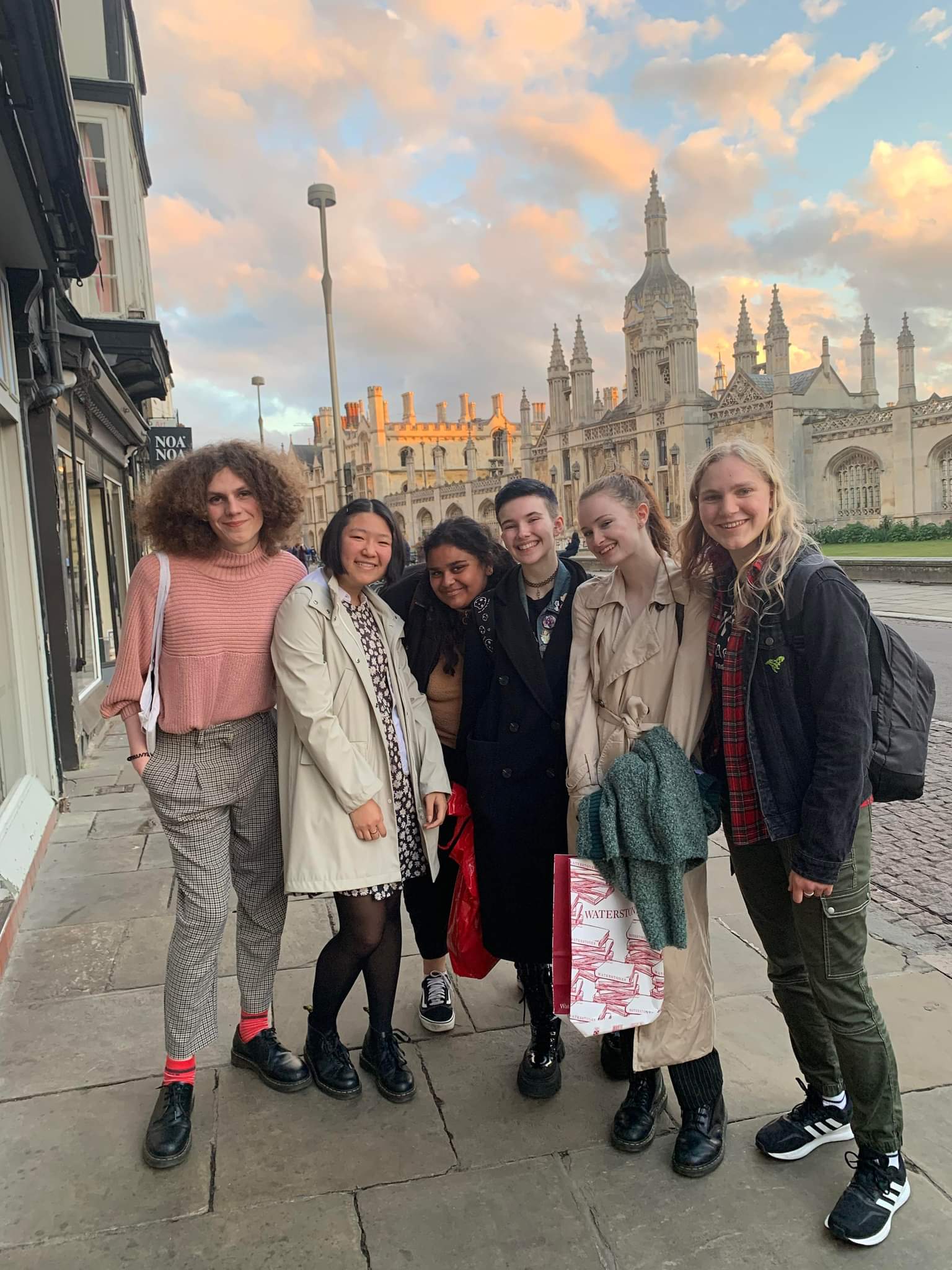 A group of friends in front of King's at sunset