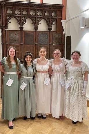 Five students in regency-themed dress