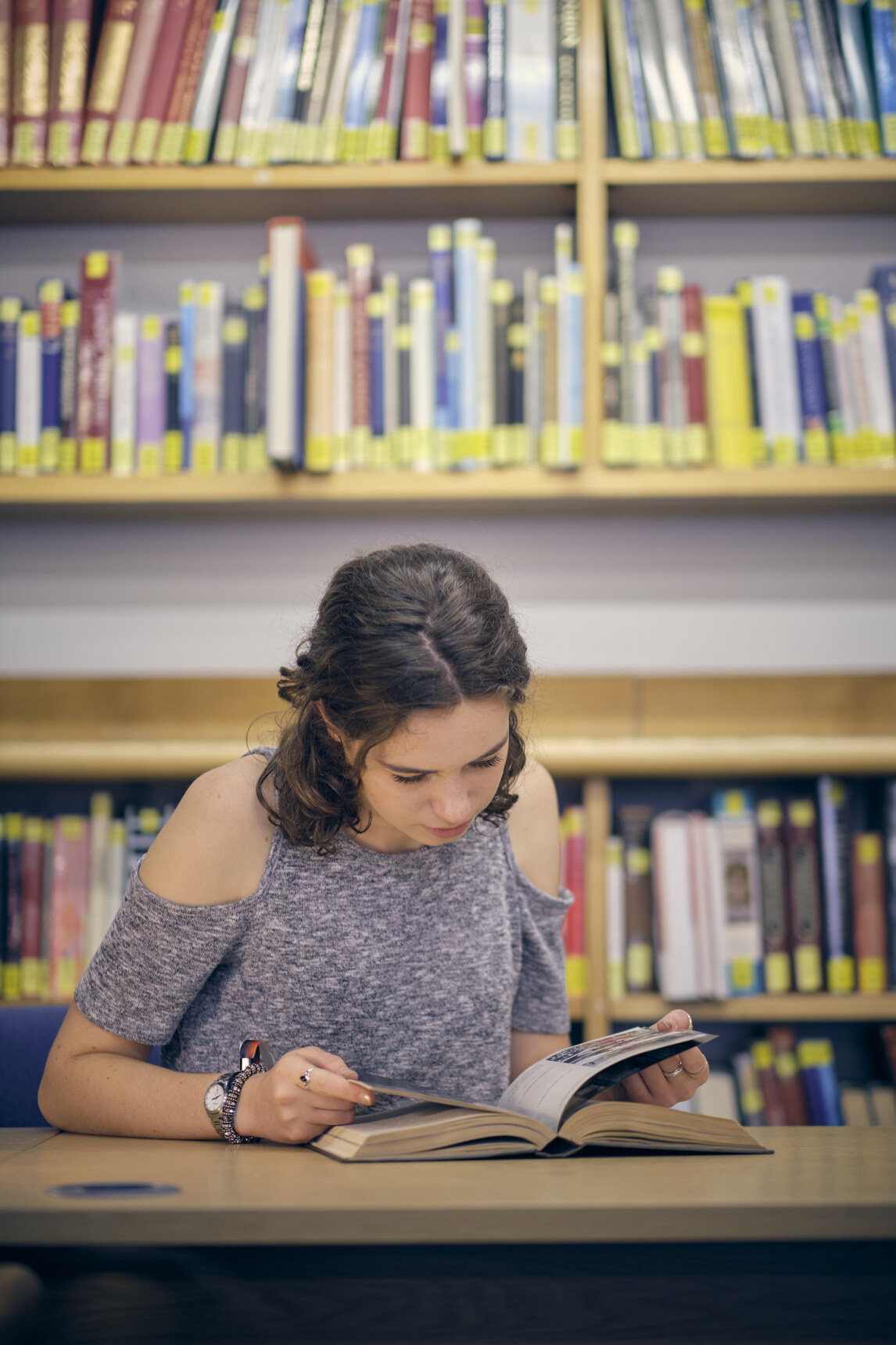 Student reading in the library