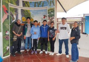 Group of people in front of information board