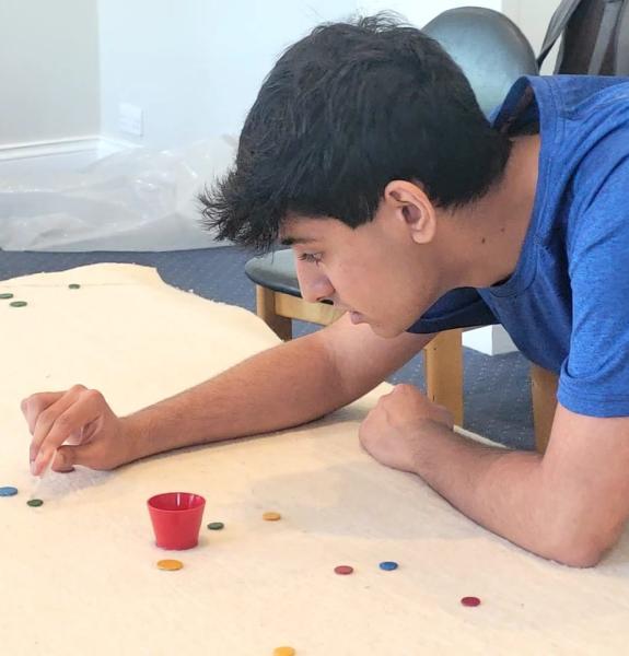 Adam playing tiddlywinks