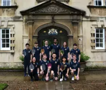 The Christ's College Badminton team pose outside the gate to the Fellows Garden at Christ's College, Cambridge.