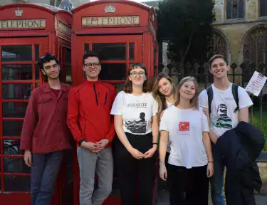 Students in front of telephone box