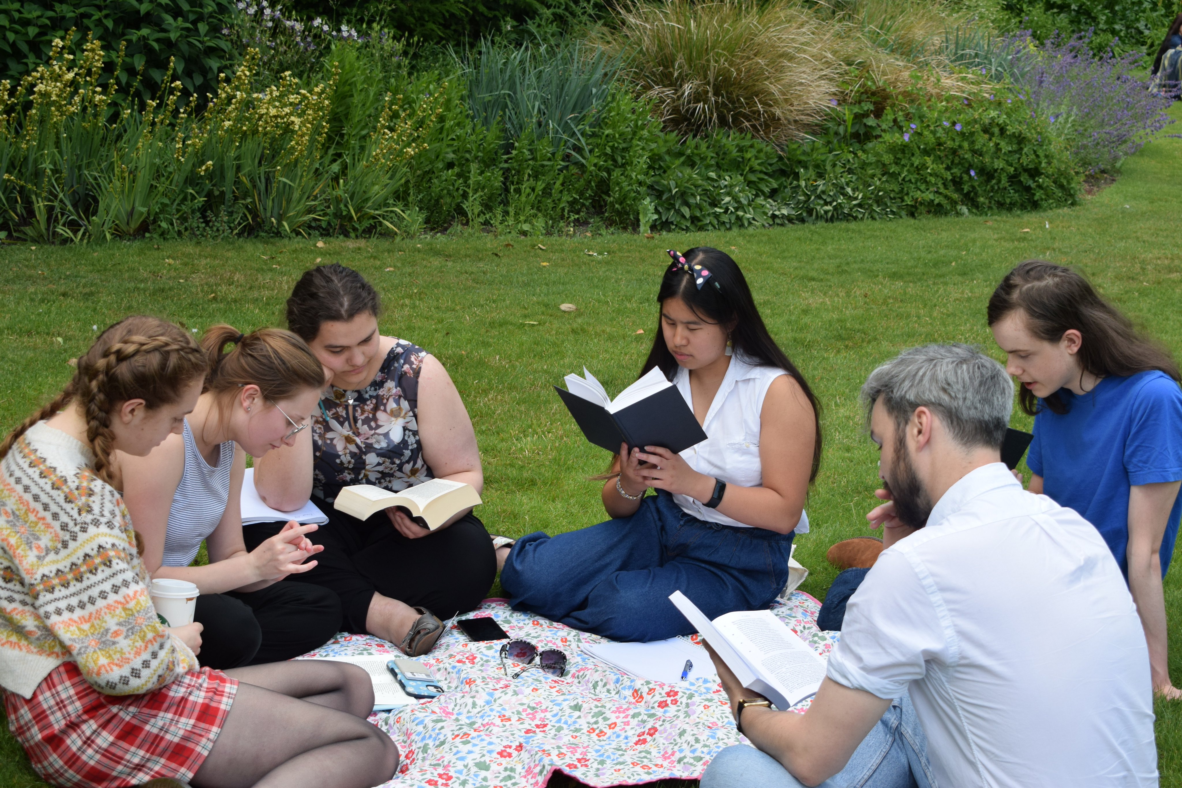A group reading Homer in the Fellows' Garden